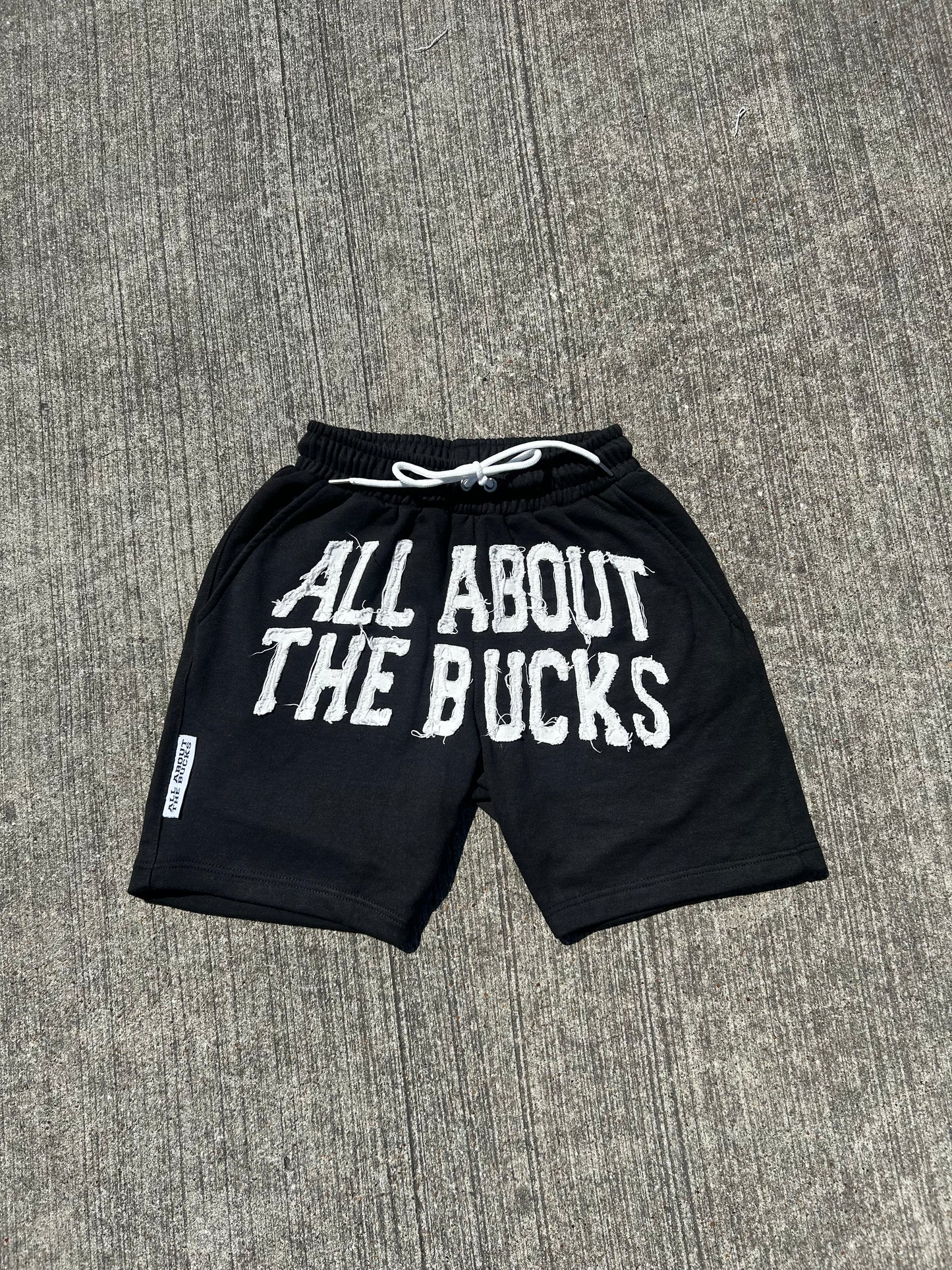 Black AllAboutTheBuck$ Distressed Shorts